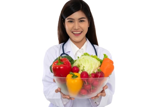 Doctor or nutritionist holding fresh fruit Orange, red and green apples and smile in clinic. Healthy diet Concept of nutrition food as a prescription for good health, fruit is medicine photo