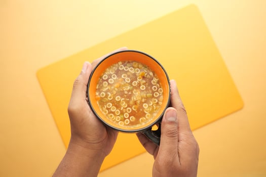 instant cup soup in a mug on table photo