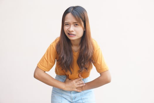 Asian woman having stomachache from menstruation photo