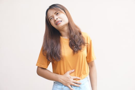 Asian woman having stomachache from menstruation photo