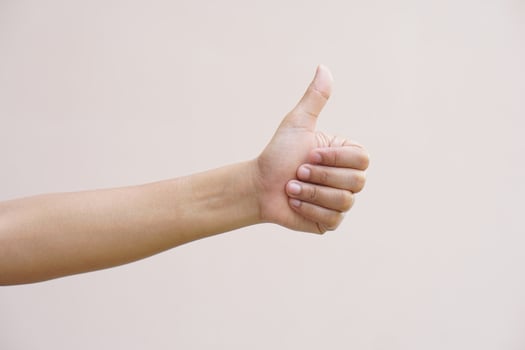 Asian woman doing her hand as a great sign photo