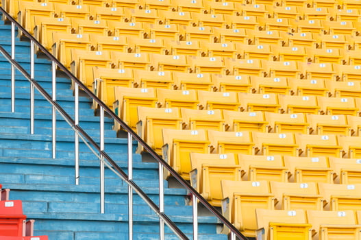 Empty yellow seats at stadium,Rows of seat on a soccer stadium,select focus photo
