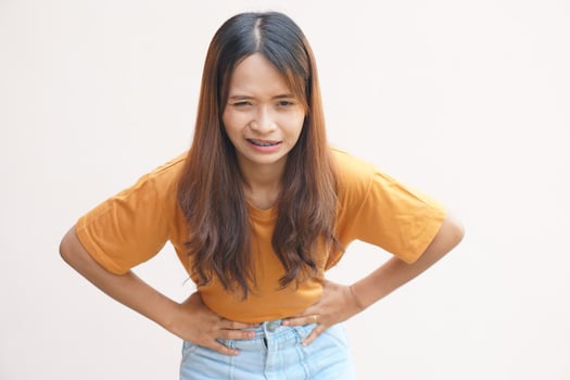 Asian woman having stomachache from menstruation photo