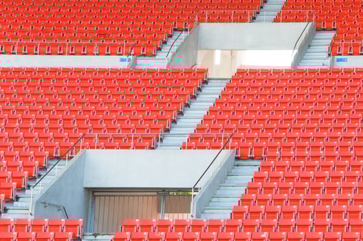 Empty orange seats at stadium,Rows of seat on a soccer stadium photo