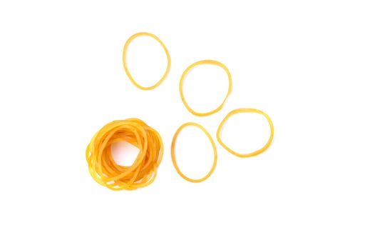 Brown rubber bands isolated on white background. Concept, equipment for fasten, tie general things, bind small objects together,made from natural para rubber. Sticky, flexibility,  used for versatile. photo