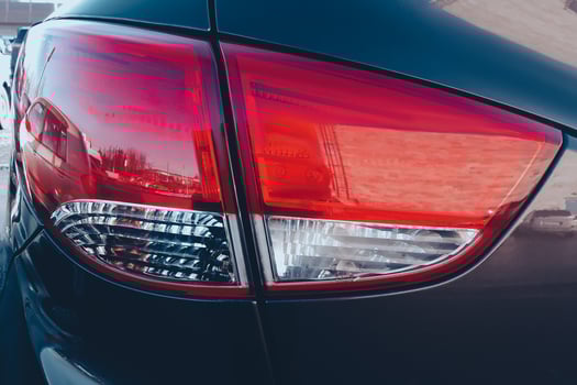 Car red stop signal close-up. Modern lighting devices of luxury car. photo