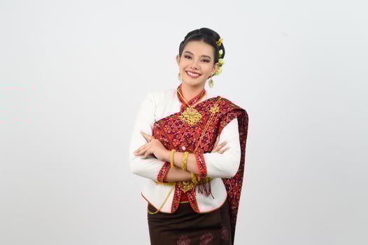 Portrait of Beautiful Thai Woman in Traditional Clothing standing Posing photo