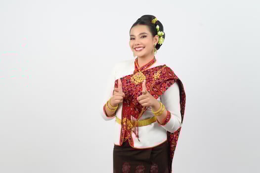 Young beautiful woman in northeastern dress stand and point finger posture photo