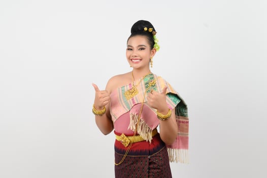 Young beautiful woman in north eastern dress stand and point finger posture photo