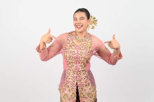 Young beautiful woman dress up in local culture in southern region with various posture photo
