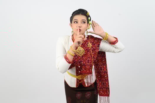Young beautiful woman Thai Lanna dress on with shouting posture photo