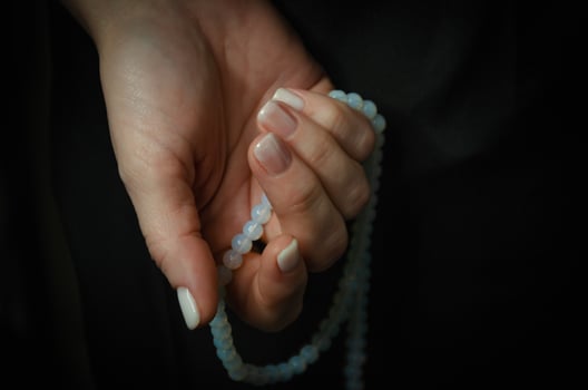 on a dark background light nails after manicure photo