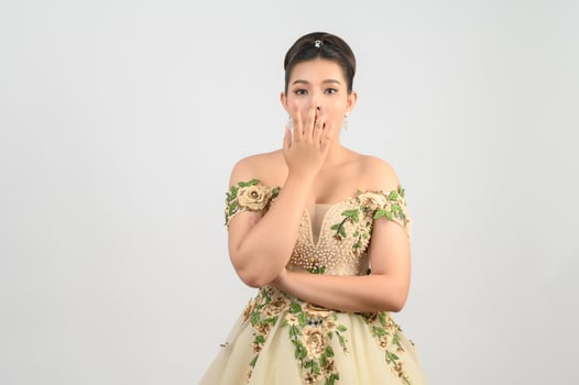 Young asian beautiful bride pose with excited feel on white background photo