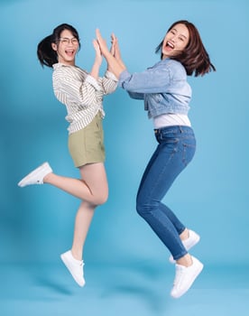 Two women on blue background photo