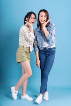 Two women on blue background photo