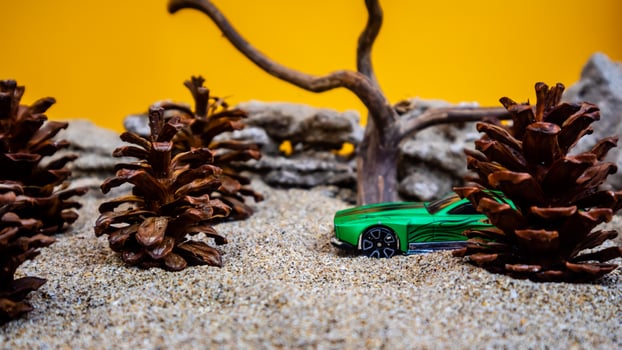 Minahasa, Indonesia  saturday, December 2022, a toy car among the pinecones photo