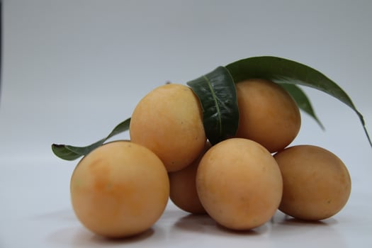 Sweet Marian plum thai fruit isolated on white background photo