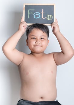 fat boy hold blackboard photo