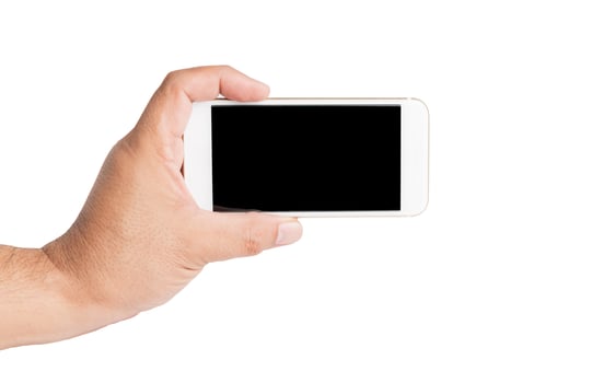 Hand holding mobile smart phone with blank screen. photo