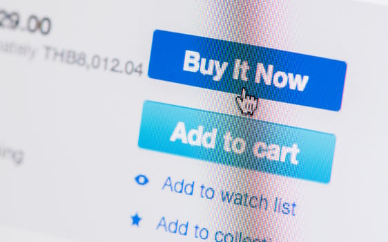 hand mouse cursor on buy it now button photo
