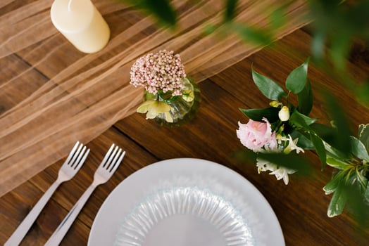 Festive wedding, festive table setting with silver cutlery, tulle ribbon, eucalyptus branches, eustoma and hyacinthas flowers. The concept of the restaurant menu. Flat lay, top view photo