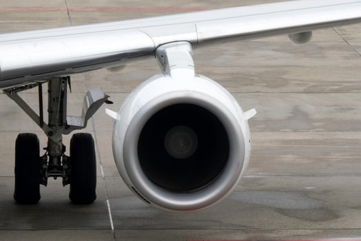 engine detail of airplane while parking at the terminal photo