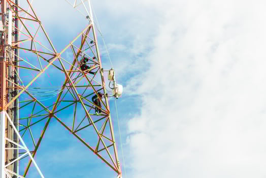 worker work on mobile tower photo