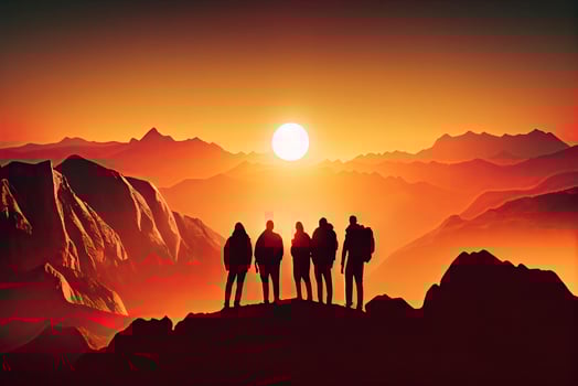 Team success concept photo, friends standing together on the top of the hill, over beautiful mountains landscape in gold sunset light photo
