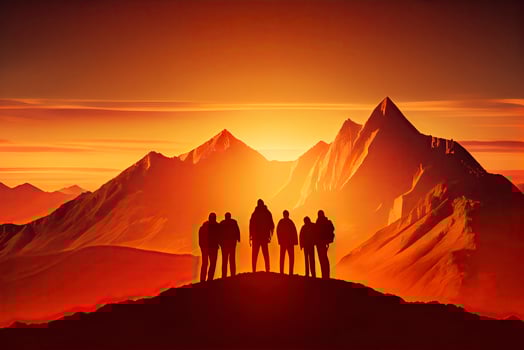 Team success concept photo, friends standing together on the top of the hill, over beautiful mountains landscape in gold sunset light photo