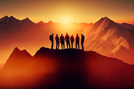 Team success concept photo, friends standing together on the top of the hill, over beautiful mountains landscape in gold sunset light photo
