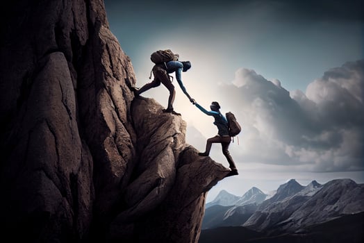 Team work, life goals and self improvement concept. Man helping his female climbing partner up a steep edge of a mountain photo