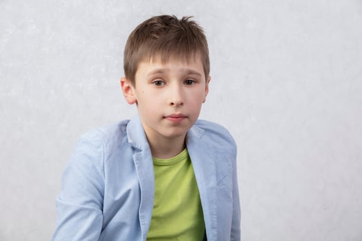 Portrait of a boy of middle school age in a jacket. The child is ten years old. photo