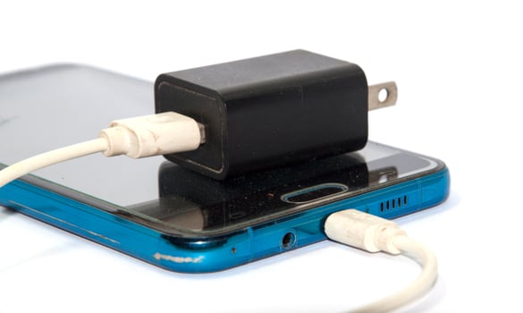 Mobile and phone chargers black and white on white background It is state of the art equipment and technology. Shot in my home studio with lights and flash for clarity. photo