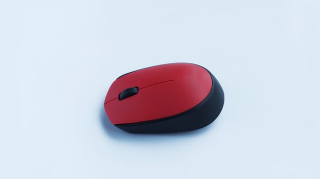 Simple red mouse computer accessories wireless isolated on white. photo