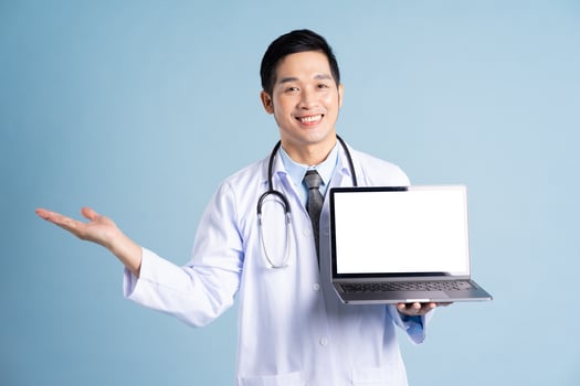 Asian male doctor portrait on blue background photo