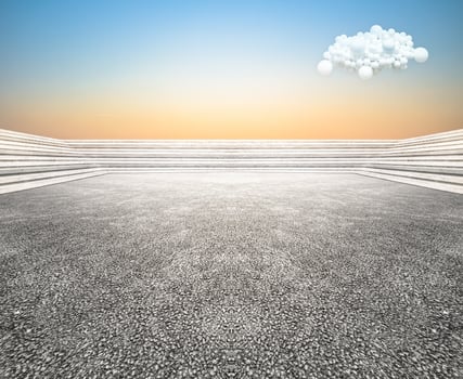 Low view curved step building terrace with wide unmanned asphalt floor, with balloon cloud sky background. photo
