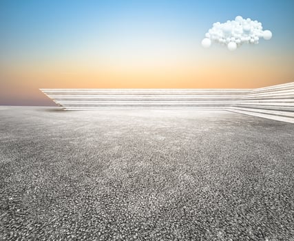 Low view curved step building terrace with wide unmanned asphalt floor, with balloon cloud sky background. photo