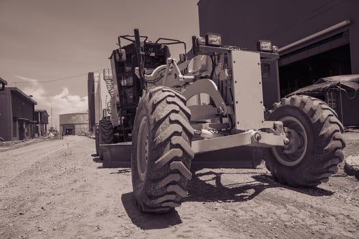 Land scraper and Vibro roller the heavy equipment for pretreatment road construction.  The photo is suitable to use for industry background photography, power plant poster and electricity.