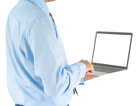 Businessman holding a laptop with clipping path photo