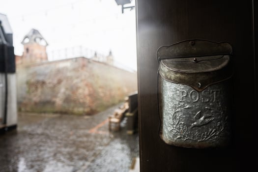 Vintage post mail box against castle wall. photo