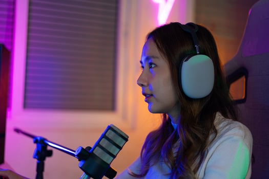 Gamer and E-Sport online of Asian woman playing online computer video game with lighting effect, broadcast streaming live at home. Gamer and E-Sport online gaming technology Championship tournament. photo