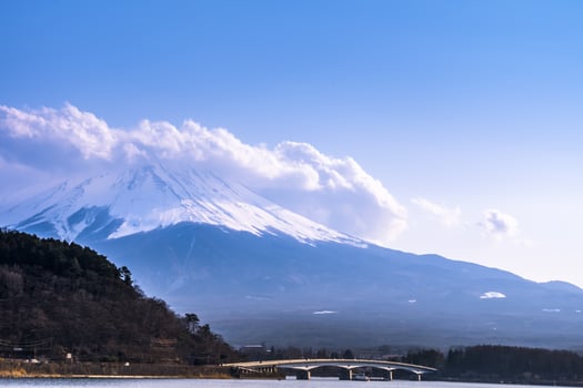 Mount Fuji, Large clouds with snow cover on the top.fujisan mountain around Lake Kawaguchiko in japan photo