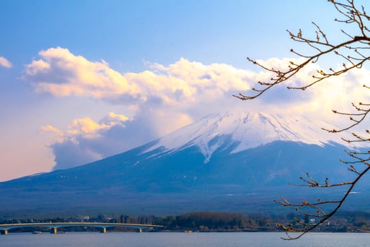Mount Fuji, large clouds covering the top of the mountain.Landscape View With Water At Kawaguchiko Lake, Japan photo