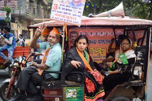 Delhi, India, December 02 2022 -Bharatiya Janata Party BJP supporter during mega road show in support of BJP candidate Pankaj Luthara to file nomination papers ahead of MCD local body Elections 2022 photo