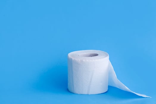 Toilet paper  on blue background. photo