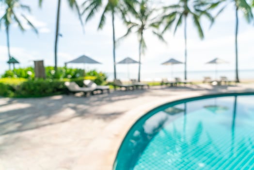 abstract blur bed pool around swimmimg pool in luxury hotel resort for background photo