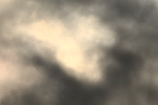 Sun behind the darl clouds photo