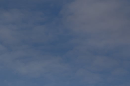 Clear blue sky and white clouds photo