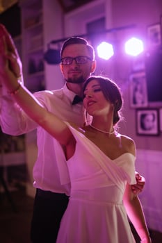 the first dance of the bride and groom inside a restaurant photo