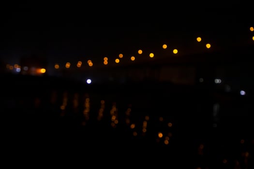 Colorful Defocus Abstract bokeh light effects on the night black background texture photo